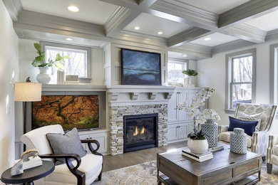 Example of an arts and crafts open concept brown floor family room design in Minneapolis with white walls, a standard fireplace, a stone fireplace and no tv