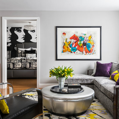 Family room - mid-sized contemporary family room idea in New York with gray walls, a wall-mounted tv and no fireplace