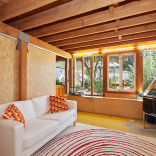 Inspiration for a contemporary enclosed concrete floor family room remodel in San Francisco with beige walls