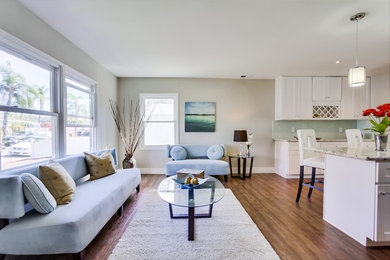 Example of a minimalist family room design in San Diego