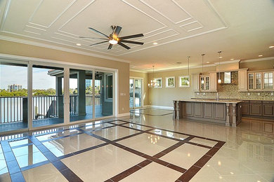 Large classic open plan games room in Tampa with beige walls, porcelain flooring and no fireplace.