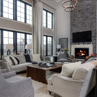 Inspiration for a large contemporary open concept dark wood floor family room remodel in Baltimore with gray walls, a standard fireplace, a stone fireplace and a wall-mounted tv