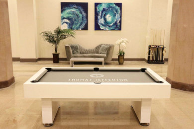 Game room - large modern open concept ceramic tile and beige floor game room idea in Atlanta with beige walls, no fireplace, a wood fireplace surround and a media wall
