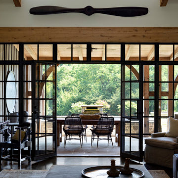 A Glass Wall Connects The Family Room To The Garden