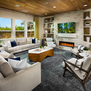 Inspiration for a contemporary family room remodel in San Diego with a ribbon fireplace, a brick fireplace and a wall-mounted tv