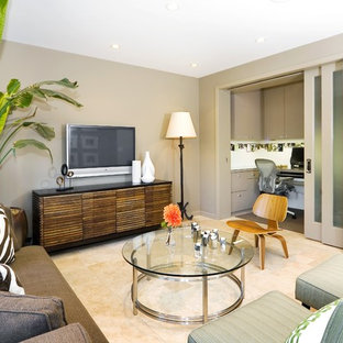 Example of a trendy enclosed family room design in San Francisco with beige walls and a wall-mounted tv