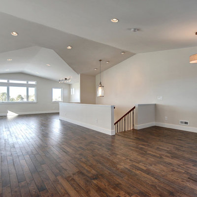 Family room - large craftsman open concept medium tone wood floor family room idea in Denver with a bar, beige walls, a two-sided fireplace and a tile fireplace