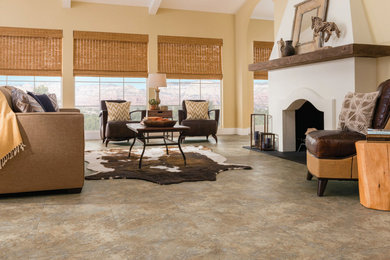 Mountain style ceramic tile and beige floor family room photo in Other