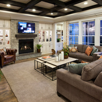 Family room - mid-sized traditional light wood floor family room idea in Raleigh with a standard fireplace, a wall-mounted tv, white walls and a stone fireplace