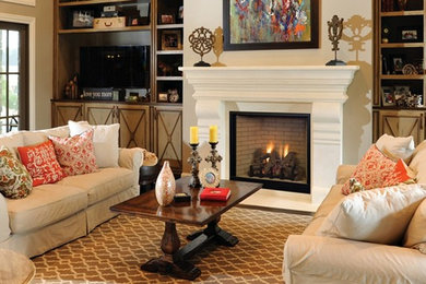 Family room - mid-sized transitional enclosed medium tone wood floor and brown floor family room idea in Other with a standard fireplace, a wood fireplace surround and a wall-mounted tv