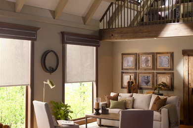Example of a large mountain style open concept medium tone wood floor and brown floor family room design in Dallas with beige walls, no fireplace and no tv