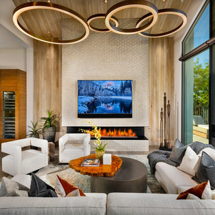 Inspiration for a contemporary family room remodel in Phoenix with a ribbon fireplace and a wall-mounted tv