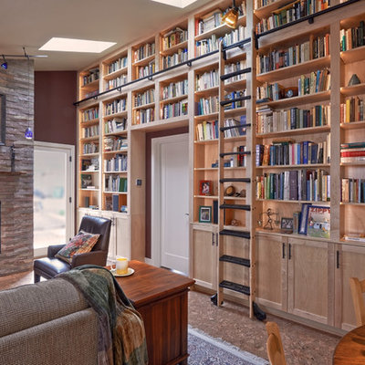 Family room library - mid-sized craftsman open concept cork floor and brown floor family room library idea in Seattle with red walls, a standard fireplace, a stone fireplace and no tv