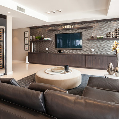 Inspiration for a large contemporary family room remodel in Miami with brown walls, no fireplace and a wall-mounted tv