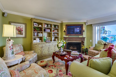 Mid-sized eclectic open concept family room photo in San Diego with green walls, a standard fireplace and a media wall