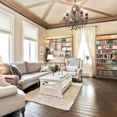 Example of a classic family room library design in Other with beige walls and no tv