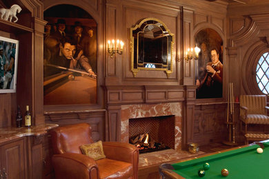 Foto de sala de juegos en casa cerrada tradicional con paredes marrones, suelo de madera oscura, todas las chimeneas, marco de chimenea de piedra y televisor colgado en la pared