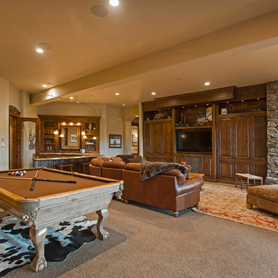 Inspiration for a rustic open concept carpeted and beige floor family room remodel in Salt Lake City with beige walls and a wall-mounted tv