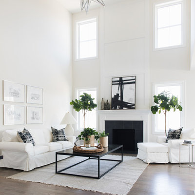 Transitional open concept family room photo in Chicago with white walls, a standard fireplace and a tile fireplace