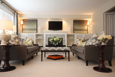 Inspiration for a large contemporary open concept carpeted family room remodel in Vancouver with beige walls, a standard fireplace, a stone fireplace and a wall-mounted tv