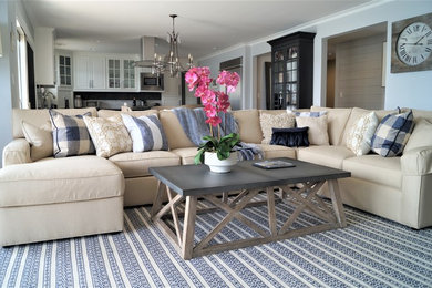 Example of a beach style family room design in San Diego