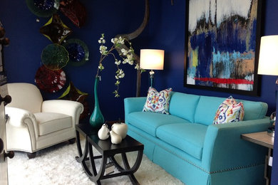 Family room - mid-sized transitional enclosed dark wood floor family room idea in Other with blue walls