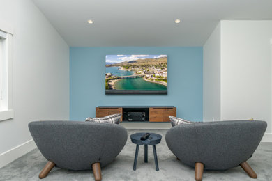 Example of a large beach style open concept carpeted and gray floor family room design in Other with a music area, blue walls and a wall-mounted tv