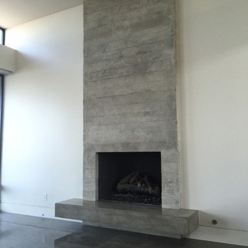 Board Formed Concrete veneer tile fireplace surround and floating hearth