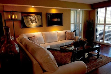 Example of a tuscan family room design in Miami