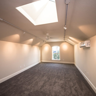 Large arts and crafts loft-style carpeted family room photo in Austin with beige walls