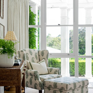 Design ideas for a mid-sized traditional open concept family room in Brisbane with white walls, carpet and beige floor.