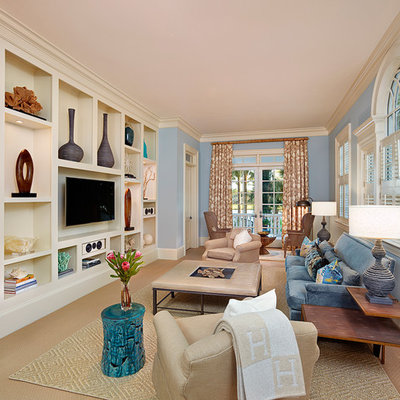 Family room - traditional enclosed carpeted family room idea in Charleston with blue walls, no fireplace and a media wall