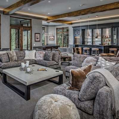 Example of a large mountain style open concept carpeted and gray floor family room design in Denver with a bar, gray walls, no fireplace and no tv