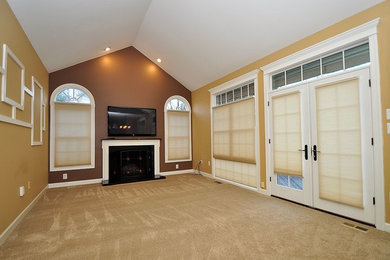 Family room - large traditional open concept carpeted and beige floor family room idea in Baltimore