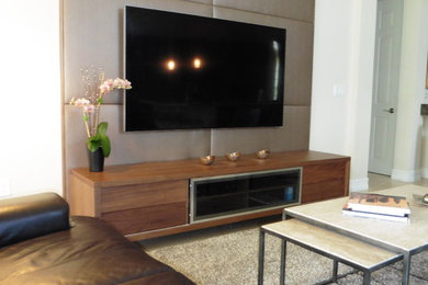 Example of a mid-sized danish open concept family room design in Miami with beige walls and a wall-mounted tv