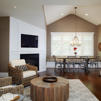 Example of a mid-sized trendy dark wood floor family room design in Philadelphia with a corner fireplace, beige walls, a wood fireplace surround and a media wall