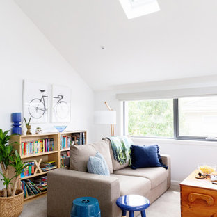 Design ideas for a transitional family room in Melbourne with white walls, carpet, grey floor and vaulted.