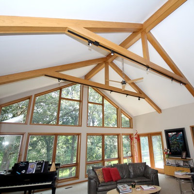 Example of a mid-sized arts and crafts open concept carpeted family room design in Other with a standard fireplace, a brick fireplace, a music area, white walls and a tv stand