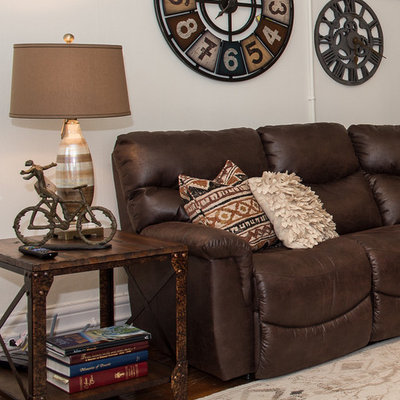 Inspiration for a mid-sized rustic enclosed medium tone wood floor and brown floor family room remodel in Other with white walls, no fireplace and no tv