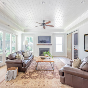 Charming Family Room with Shiplap Ceiling, Hand Scraped White Oak Floors and Lar