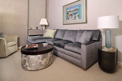 Small transitional enclosed carpeted and beige floor family room photo in New York with beige walls and a media wall