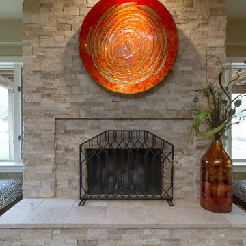 Chic Lower Level Stacked Stone Fireplace