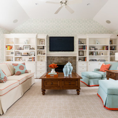 Family room - traditional family room idea in New Orleans with a standard fireplace and a stone fireplace