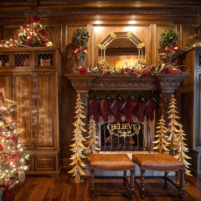 Inspiration for a timeless dark wood floor family room remodel in Chicago with a standard fireplace and a wood fireplace surround