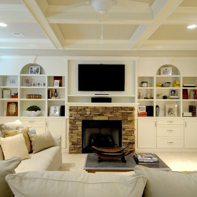 Elegant carpeted family room photo in Atlanta with a stone fireplace, a standard fireplace and white walls