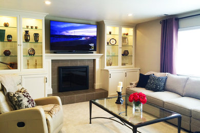 Inspiration for a mid-sized transitional family room remodel in San Francisco with a tile fireplace and a media wall