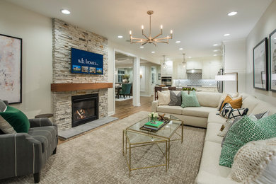 Transitional open concept light wood floor family room photo in Philadelphia with a standard fireplace, a stone fireplace and a wall-mounted tv