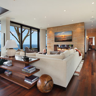Large trendy open concept family room photo in Orange County with a two-sided fireplace and white walls