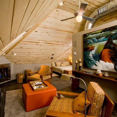 Example of a trendy family room design in Denver with beige walls and a standard fireplace