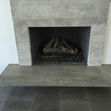 Concrete board formed veneer tile fireplace surround and floating hearth